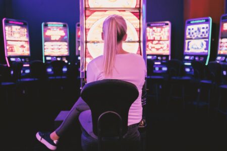 Player seated at slot machine