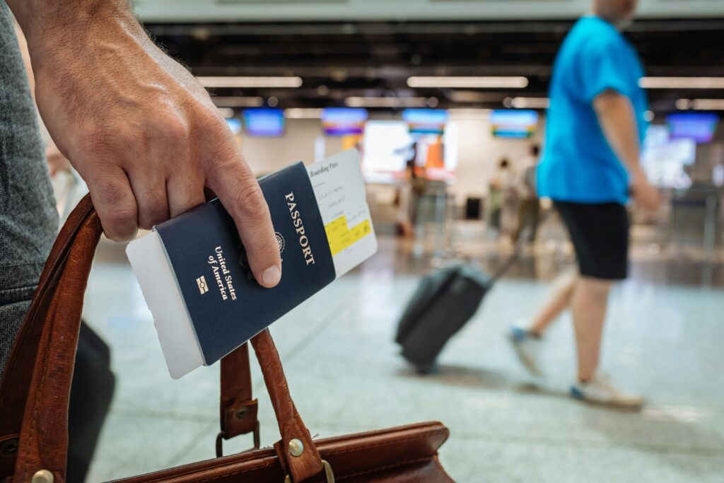 Digital Identity In 2026: The Quiet End Of The Anonymous Account Hand holding a passport